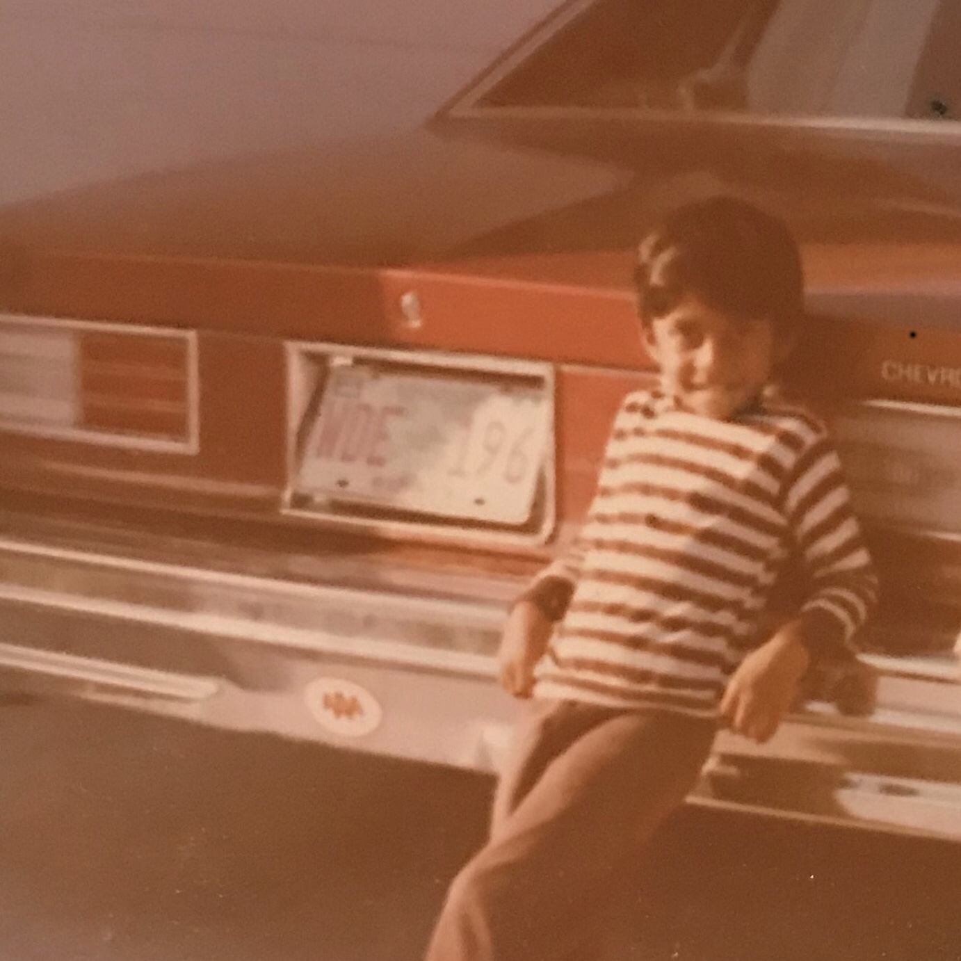 Young Harsha with a Chevrolet, circa 1979